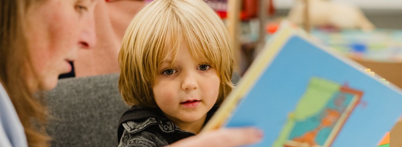 a carer reading with a child