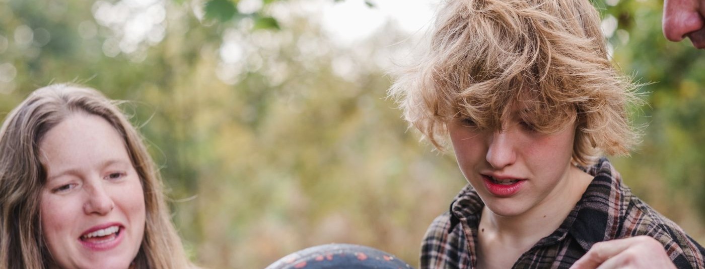 man and woman talking to a child