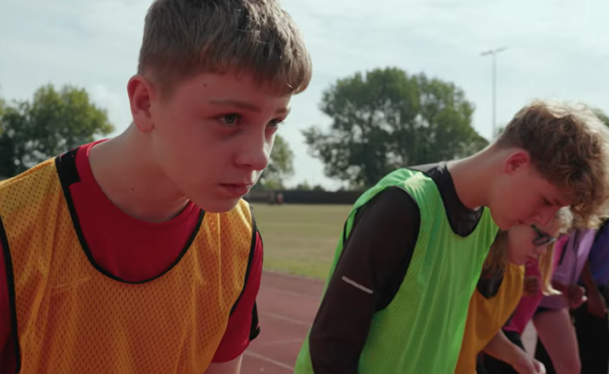 Tom lines up to run a race