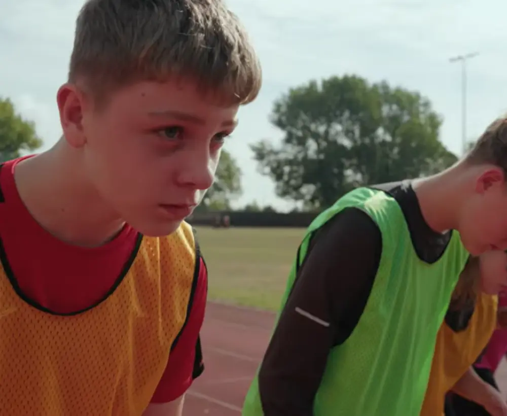 Tom lines up to run a race